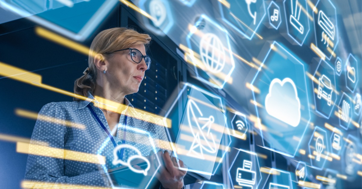 Photo showing a woman interacting with a digital overlay, representing contact center AI trends.